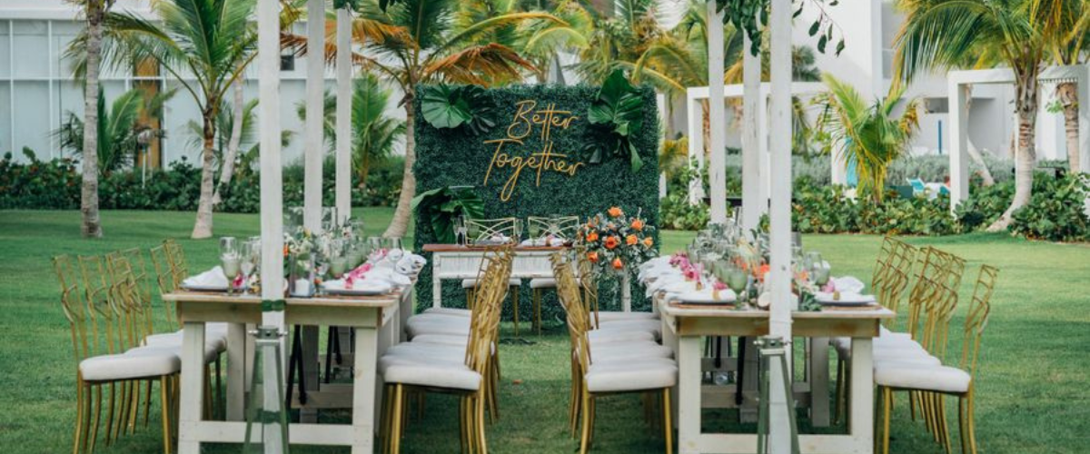 Outdoor resort wedding reception setting, elegant place settings