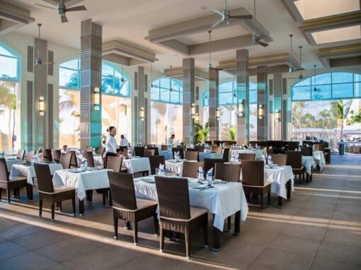 Image inside of restaurant Steakhouse at Hotel Riu in Aruba, servers are checking the tables.
