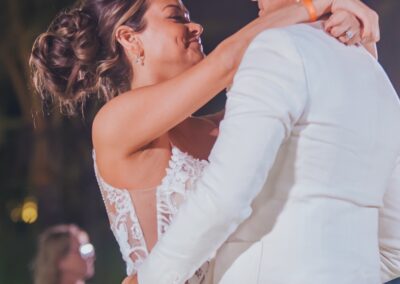 couple Shawn and Courtney dancing their first dance, smiling at each other.